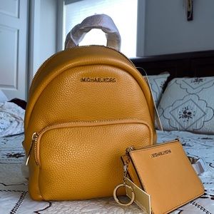 mustard yellow convertible Michael Kors backpack